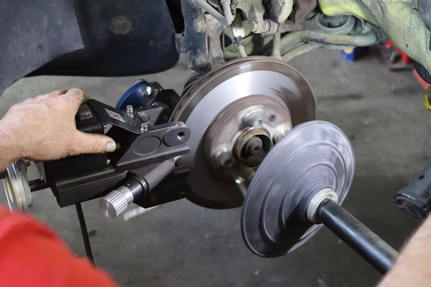 mechanic installing brake rotors in Detroit MI